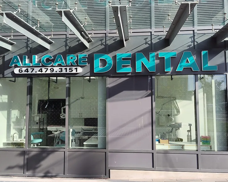 The All Care Dental storefront on Hurontario Street, under the glass canopy