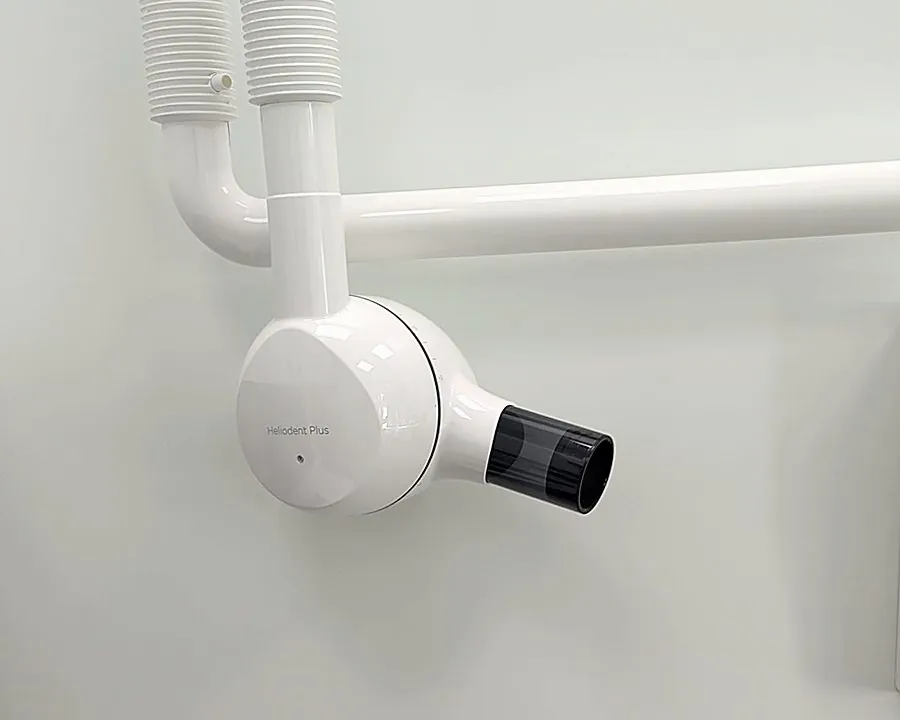 The X-ray arm on the wall of a treatment room at All Care Dental